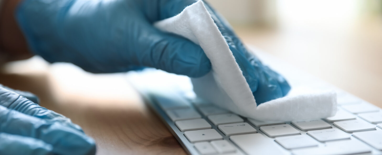 cleaning a keyboard with a anti bacterial wipe